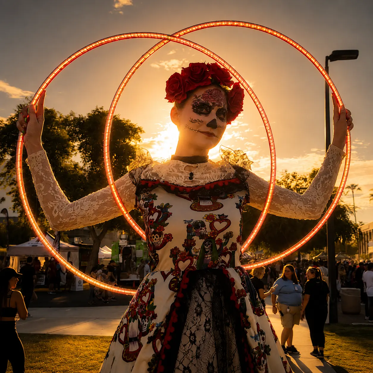 Tabitha in Day of the Dead costuming framed by illuminated hoops