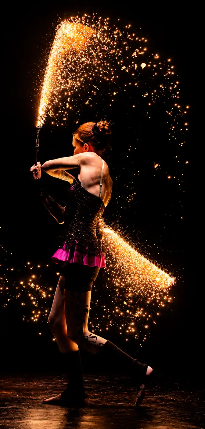 Tabitha creating a sparkling arc during a fire performance